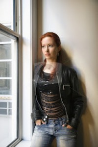 cutcaster-photo-100107689-Portrait-of-pretty-woman-at-window