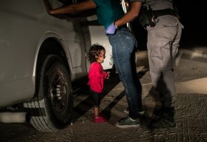 A two-year-old Honduran asylum seeker cries as her mother is searched and detained near the U.S.-Mexico border on June 12, 2018 in McAllen, Texas. They had rafted across the Rio Grande from Mexico and were detained by U.S. Border Patrol agents before being sent to a processing center. The following week the Trump administration, under pressure from the public and lawmakers, ended its contraversial policy of separating immigrant children from their parents at the U.S.-Mexico border. Although the child and her mother remained together, they were sent to a series of detention facilities before being released weeks later, pending a future asylum hearing.